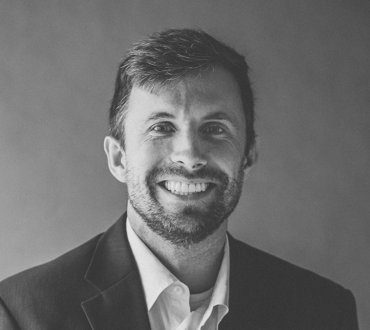 A black and white headshot of David Hobson