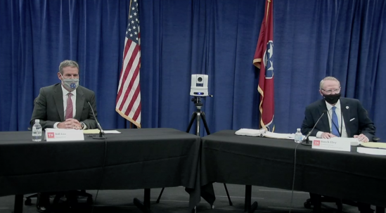 Governor Lee and Commissioner Eley wear masks at table