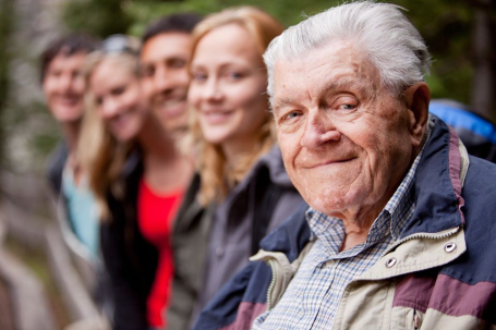 Senior citizen in line of people