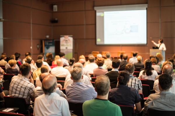 a picture of people attending a presentation