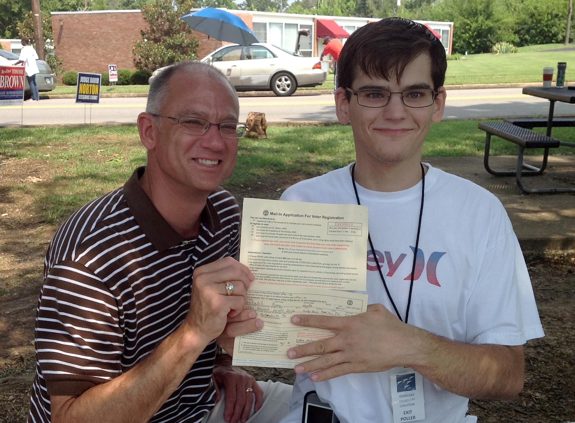 Father and Son with Voter Registration Card