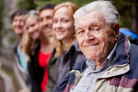 Senior citizen in line of people